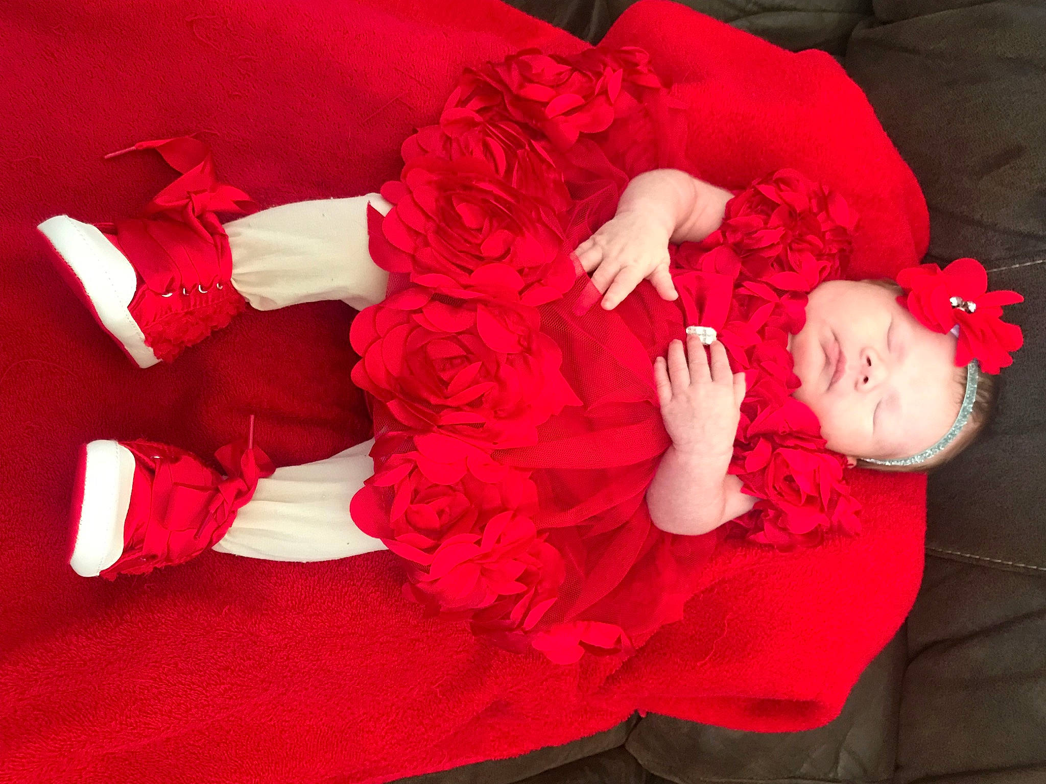 Kinlee is registered to the contest to win money with this photo: comfort, dress, flash_photography, flower, happy, headgear, headpiece, human_body, human_leg, leg, magenta, person, petal, pink, plant, red, rose, textile, thigh, toddler