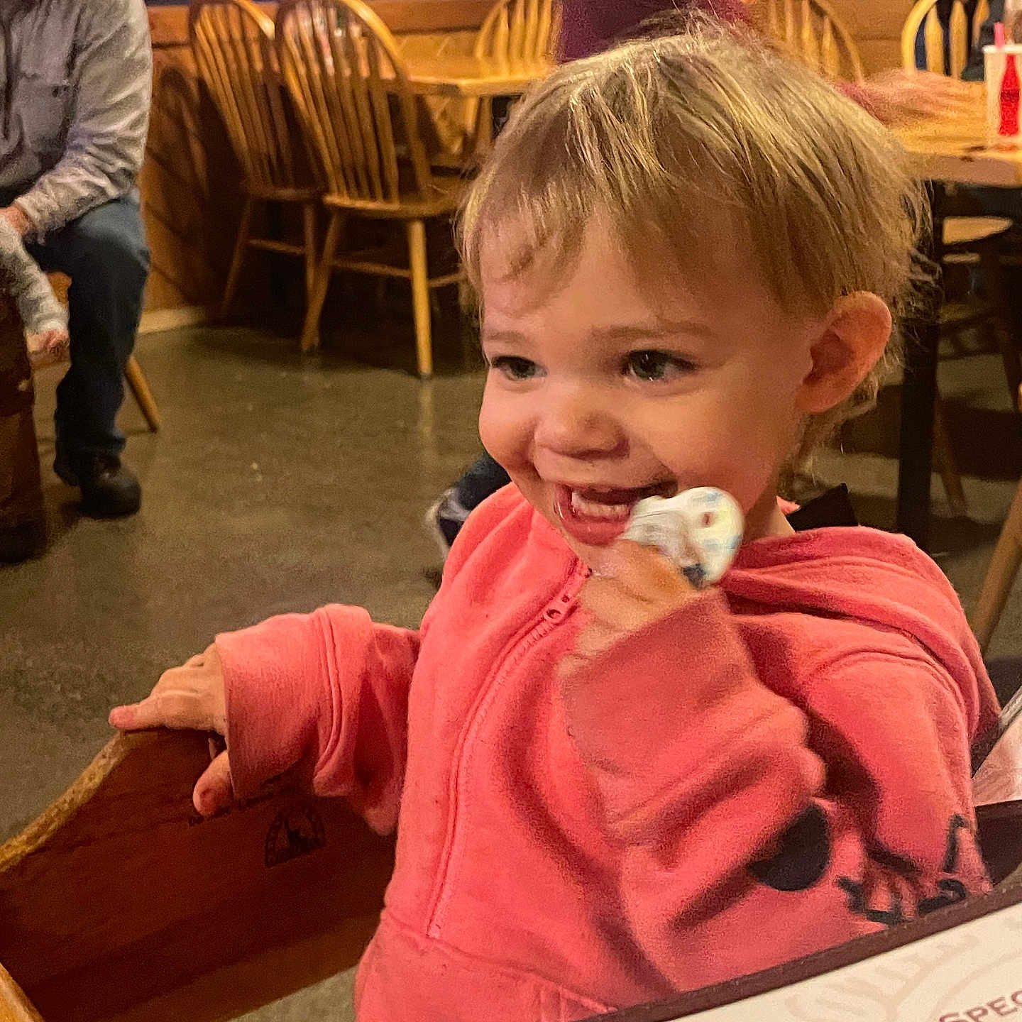 Samantha is registered to the contest to win money with this photo: adult, baby, chair, clothing, diningtable, face, footwear, furniture, hardwood, head, indoors, male, man, person, photography, plywood, portrait, shoe, table, wood