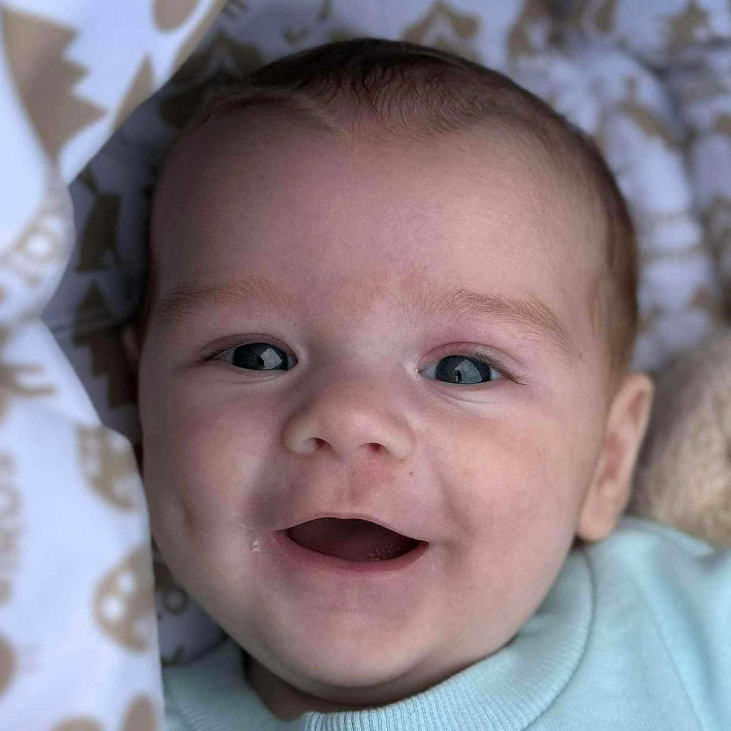 Louie- John is registered to the contest to win money with this photo: baby, blanket, cheeks, child, closeup, clothing, cozy, cute, expression, eyes, face, happy, head, infant, mouth, newborn, person, portrait, skin, smiling