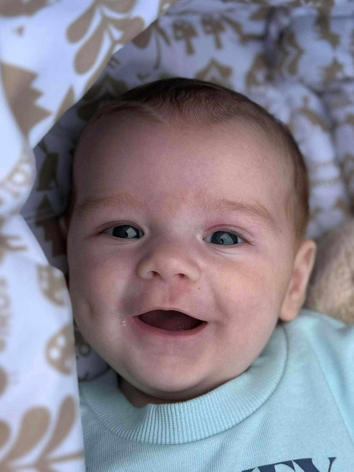 Louie- John is registered to the contest to win money with this photo: baby, blanket, cheeks, child, closeup, clothing, cozy, cute, expression, eyes, face, happy, head, infant, mouth, newborn, person, portrait, skin, smiling