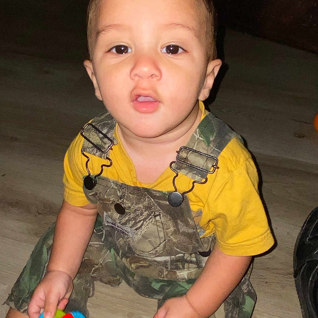 Jakobi joined the competition — help win amazing prizes! baby, bodypart, clothing, crawling, face, finger, footwear, hand, head, military, militaryuniform, mouth, pants, person, photography, portrait, shoe, shorts, t_shirt, toy