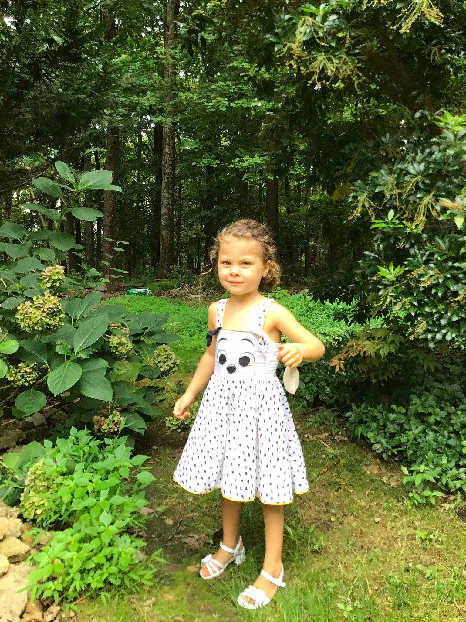 Christina is registered to the contest to win money with this photo: baby_toddler_clothing, botany, day_dress, dress, fawn, forest, garden, grass, groundcover, joy, leaf, natural_landscape, one_piece_garment, pattern, people_in_nature, person, plant, shrub, terrestrial_plant, toddler