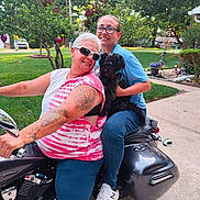 Oliver Quinn joined the competition — help win amazing prizes! casual_clothing, dog, glasses, greenery, happy, leisure, motorcycle, outdoor, person, pet, portrait, residential_area, short_hair, sidewalk, smiling, sneakers, sunlight, tattoo, two_people, vehicle