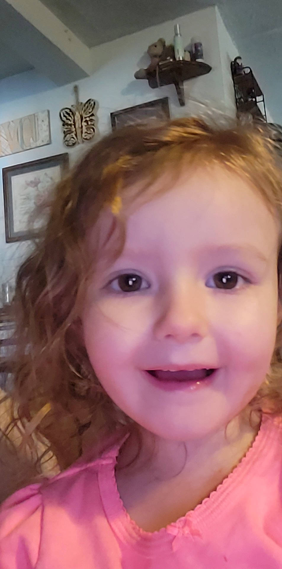 Emma is registered to the contest to win money with this photo: cheek, chin, ear, eyebrow, eyelash, forehead, fun, hairstyle, happy, iris, jaw, joy, lip, mouth, neck, nose, person, picture_frame, pink, skin