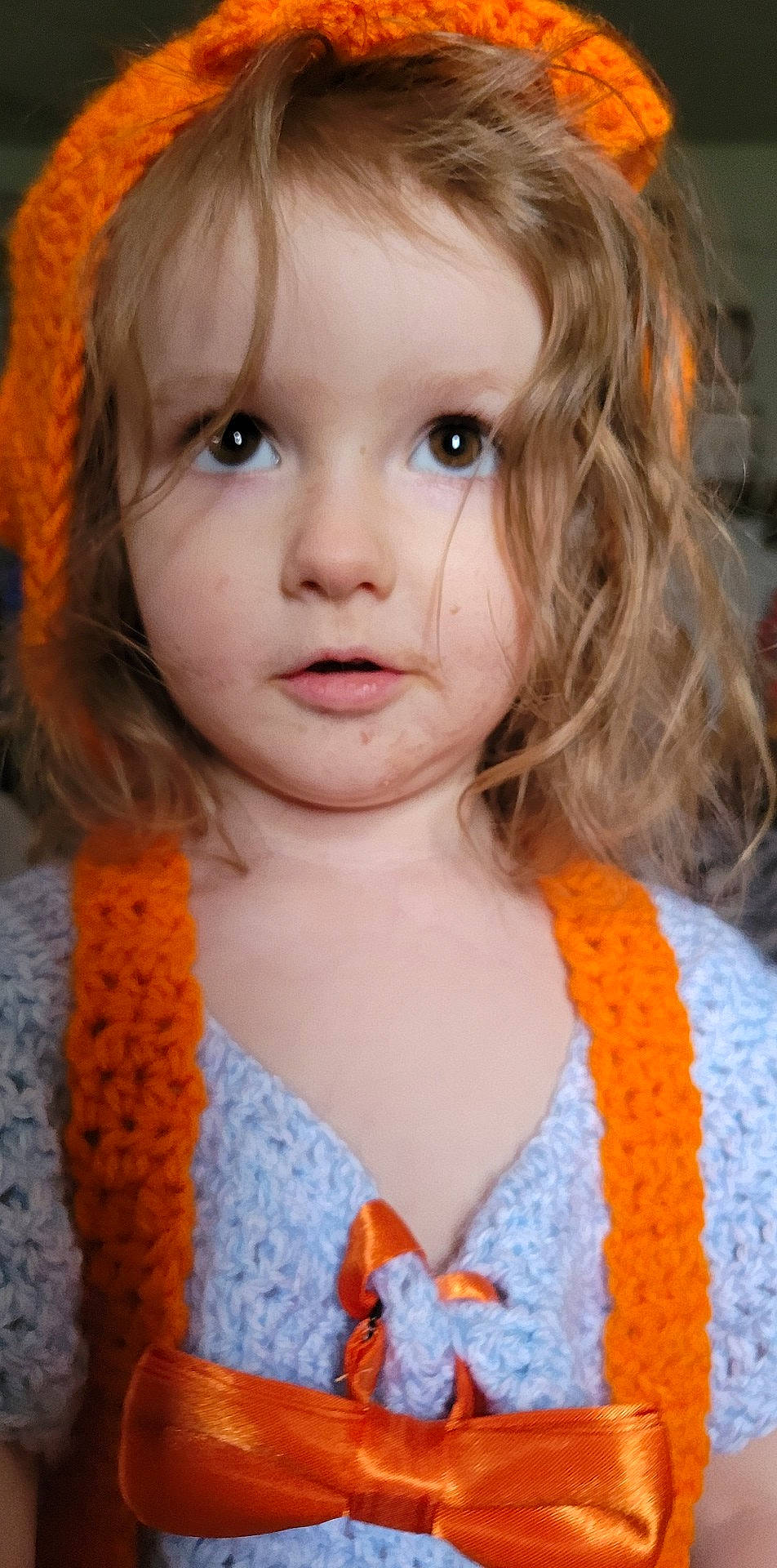 Emma is registered to the contest to win money with this photo: bangs, beauty, cheek, chin, clothing, dress, eye, eyebrow, eyelash, forehead, hair, happy, head, iris, lip, nose, orange, organ, outerwear, person