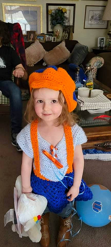 Emma joined the competition — help win amazing prizes! baby, baby_toddler_clothing, blue, cap, chair, child, costume, costume_hat, fashion_accessory, fun, happy, headwear, iris, joy, orange, pattern, person, skin, smile, standing