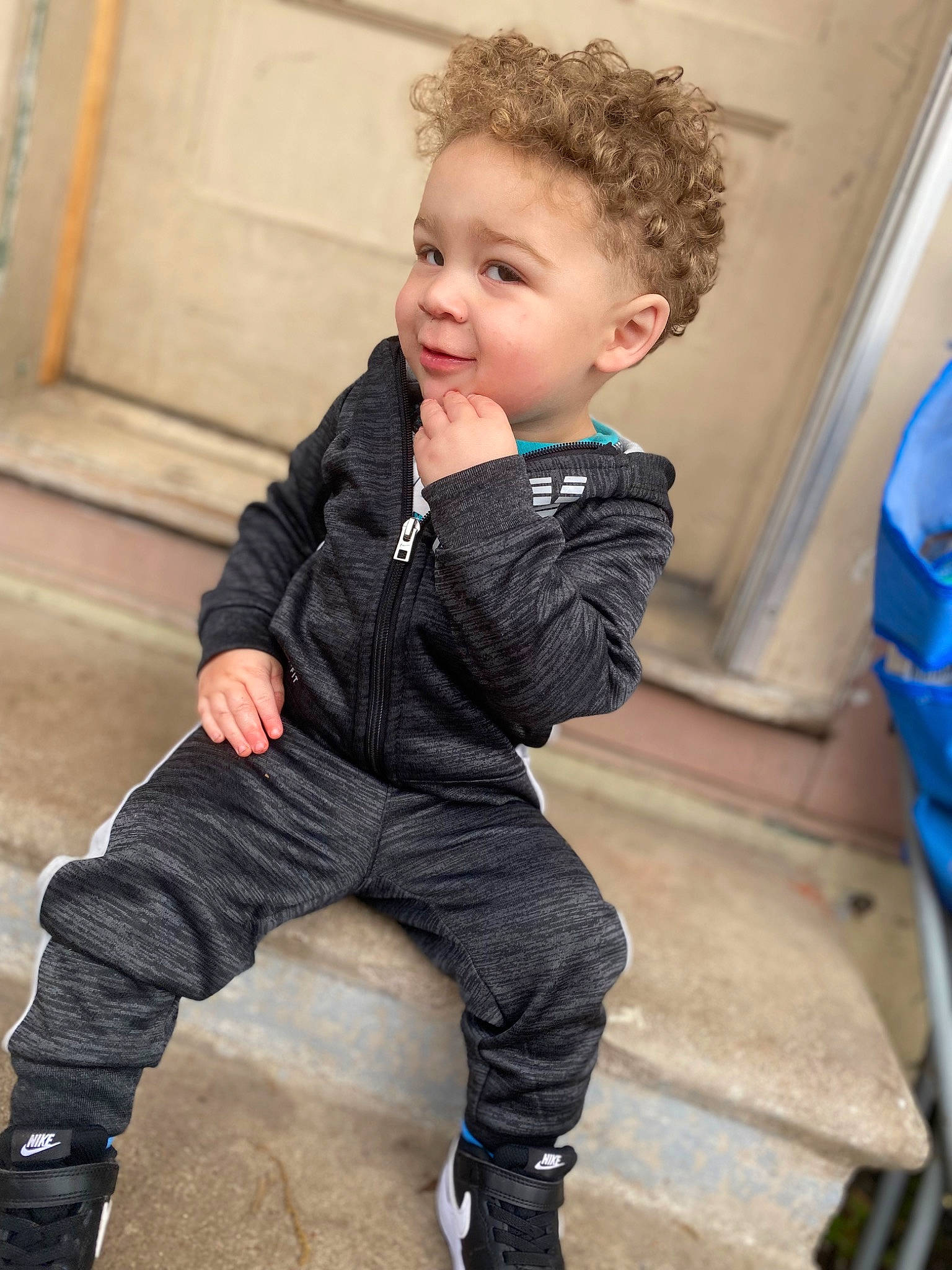 Khylan is registered to the contest to win money with this photo: baby, baby_toddler_clothing, blond, cheek, child, denim, face, flash_photography, flooring, fun, happy, outerwear, person, shoe, sitting, sleeve, smile, standing, t_shirt, toddler