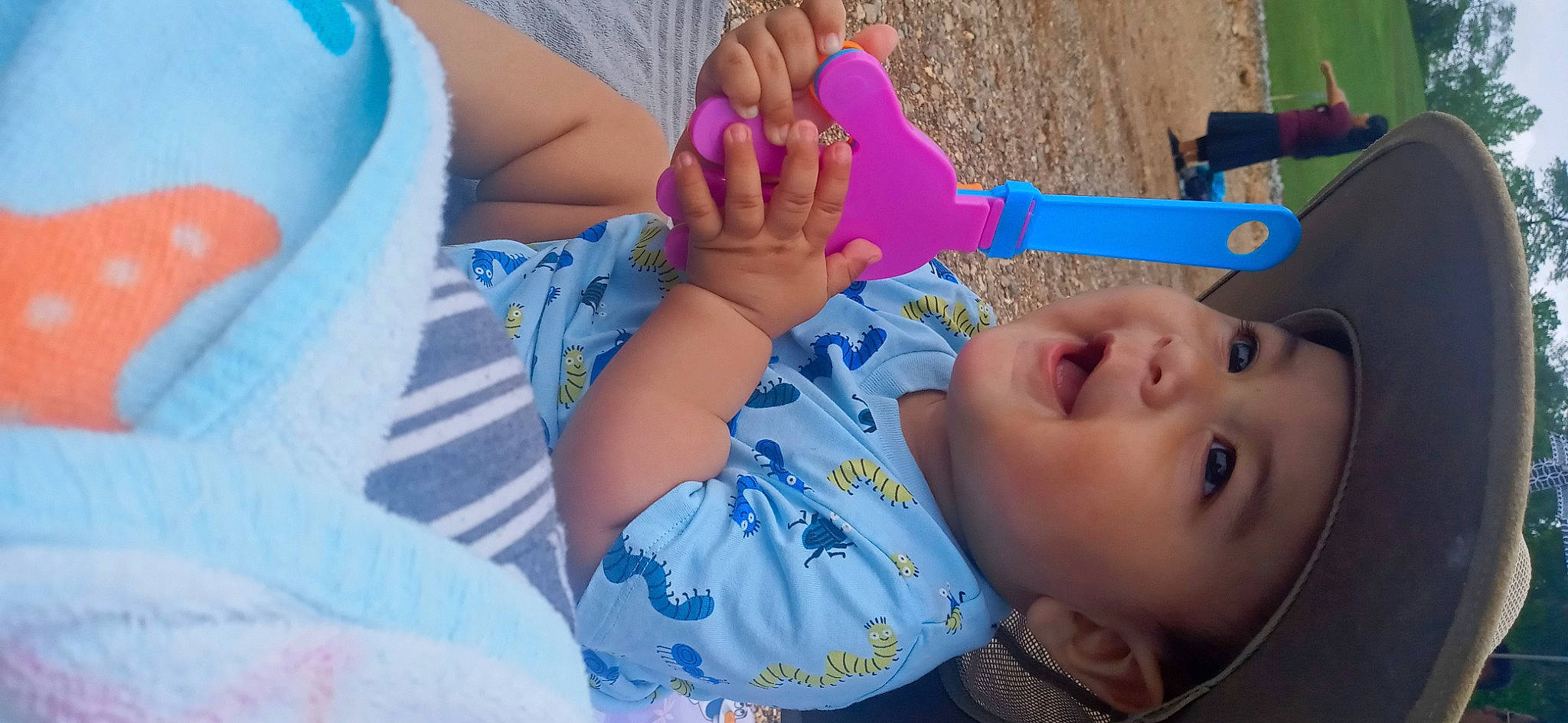 Joseph is registered to the contest to win money with this photo: baby, baby_toddler_clothing, blue, child, finger, foot, fun, gesture, hand, happy, headwear, human_body, human_leg, leisure, nail, people, person, skin, summer, thumb