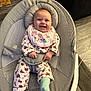 Daisy-Mae is registered to the contest to win money with this photo: baby, smiling, infant, bib, pajamas, baby_rocker, happy, indoor, floor, sock, child, cute, person, head, clothing, seat, home, face, comfort, joy