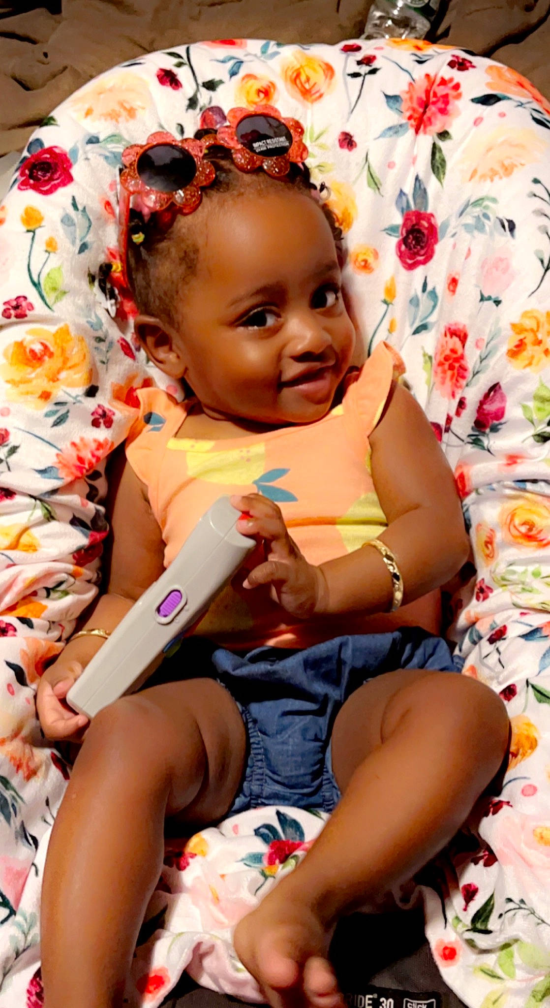 Nalani is registered to the contest to win money with this photo: arm, baby, baby_toddler_clothing, cheek, comfort, eye, face, facial_expression, finger, fun, hairstyle, happy, head, iris, joy, lip, person, pink, skin, smile