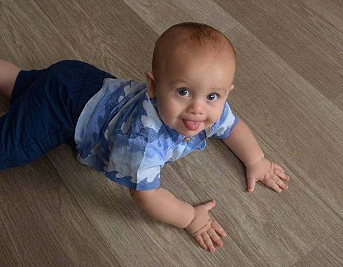 Andrew joined the competition — help win amazing prizes! baby, baby_toddler_clothing, cheek, child, floor, flooring, grass, happy, hardwood, laminate_flooring, nose, pattern, person, plank, skin, smile, toddler, varnish, wood, wood_flooring