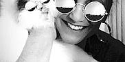 Jaspurr is registered to the contest to win money with this photo: person, cat, sunglasses, black_and_white, smile, fluffy_cat, indoor, portrait, funny, reflection, head, hand, hair, window, curtain, fashion, eyewear, happy, closeup, cute
