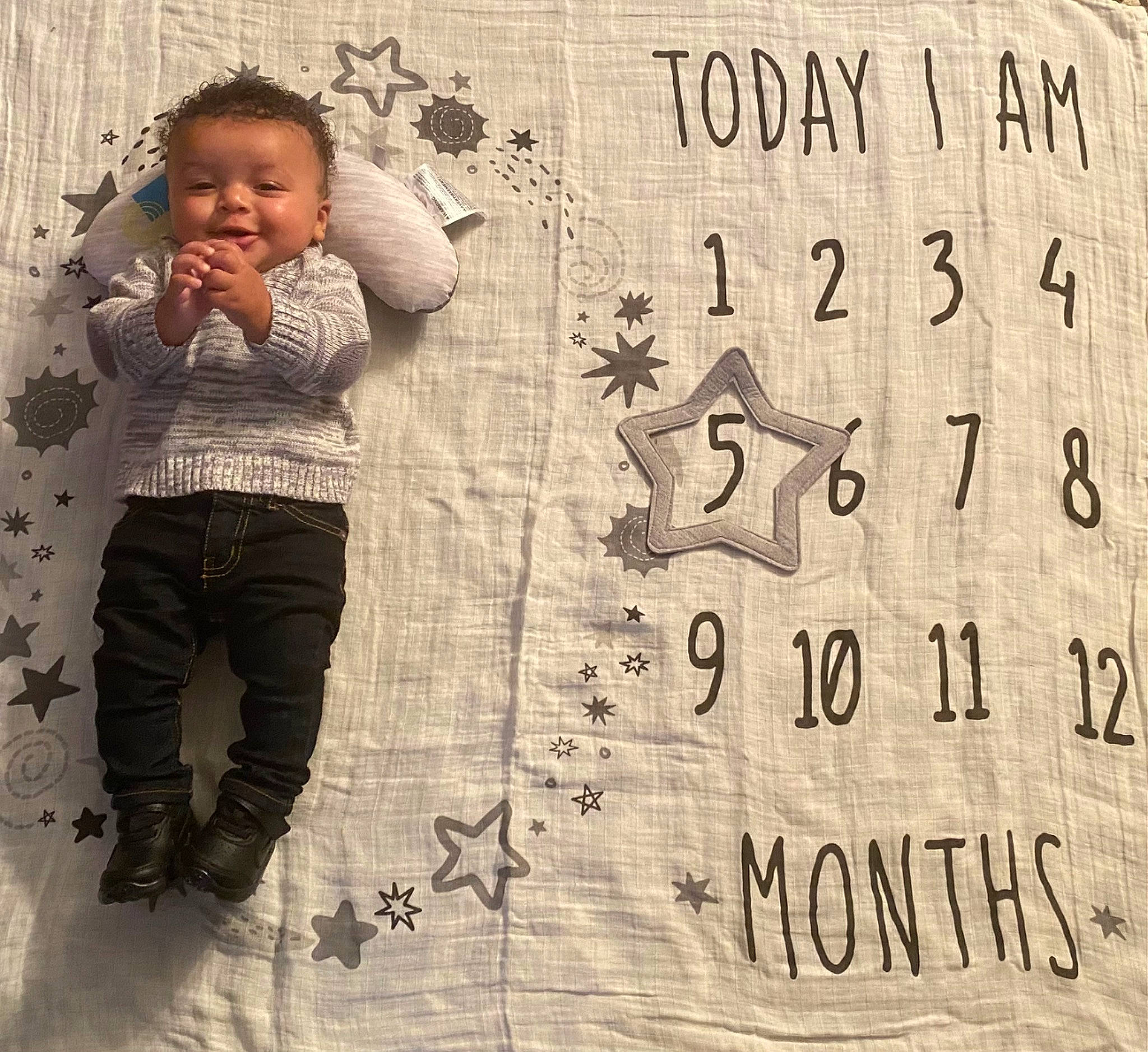 Malachi is registered to the contest to win money with this photo: art, baby, baby_toddler_clothing, child, drawing, font, handwriting, happy, illustration, monochrome, paper, paper_product, pattern, people_in_nature, person, photograph, sleeve, toddler, vintage_clothing, wood