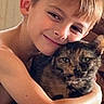 boy, child, cat, tortoiseshell_cat, hug, affection, indoor, portrait, smile, pet, animal, love, closeup, happy, young, cuddle, feline, face, skin, human