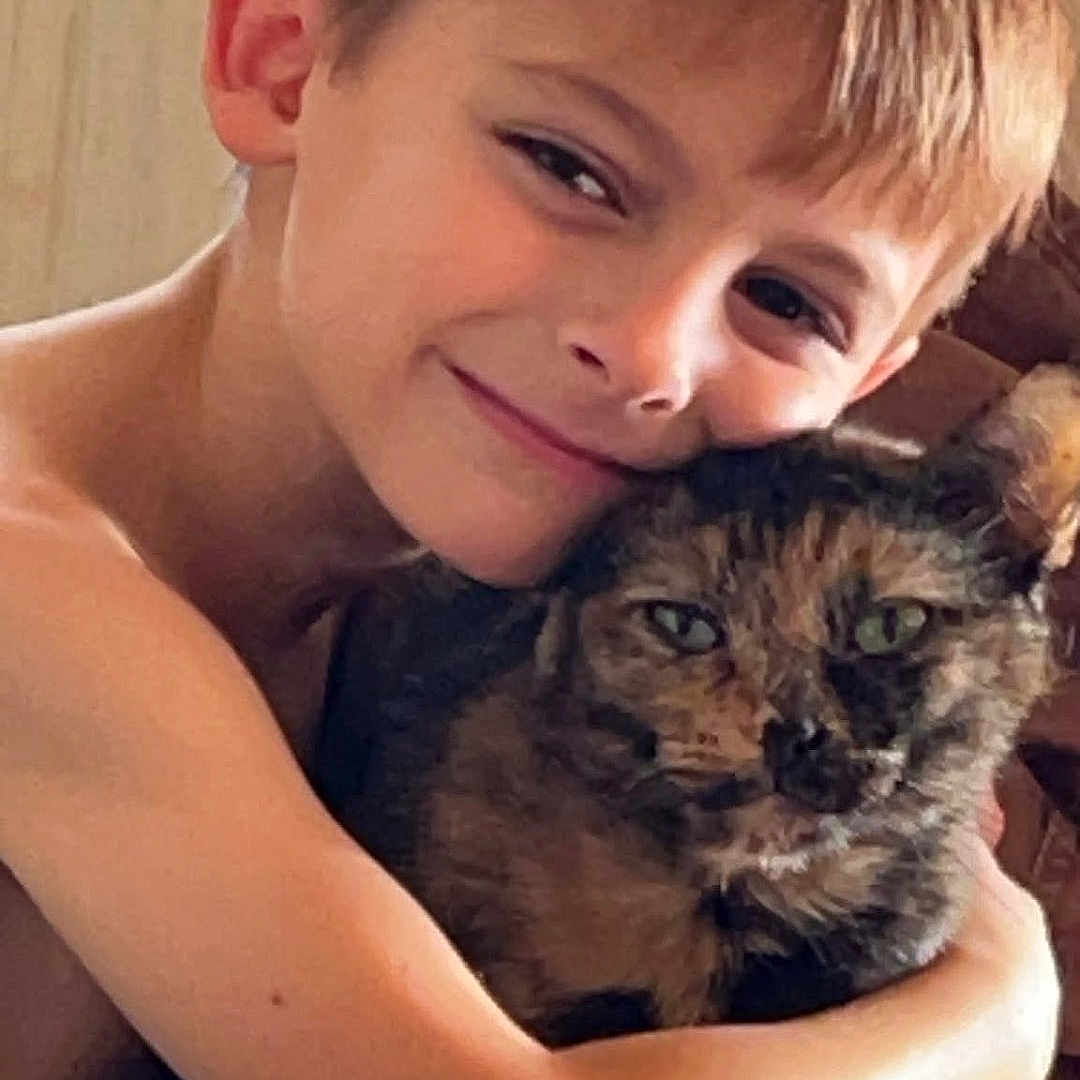 Annabelle joined the competition — help win amazing prizes! boy, child, cat, tortoiseshell_cat, hug, affection, indoor, portrait, smile, pet, animal, love, closeup, happy, young, cuddle, feline, face, skin, human