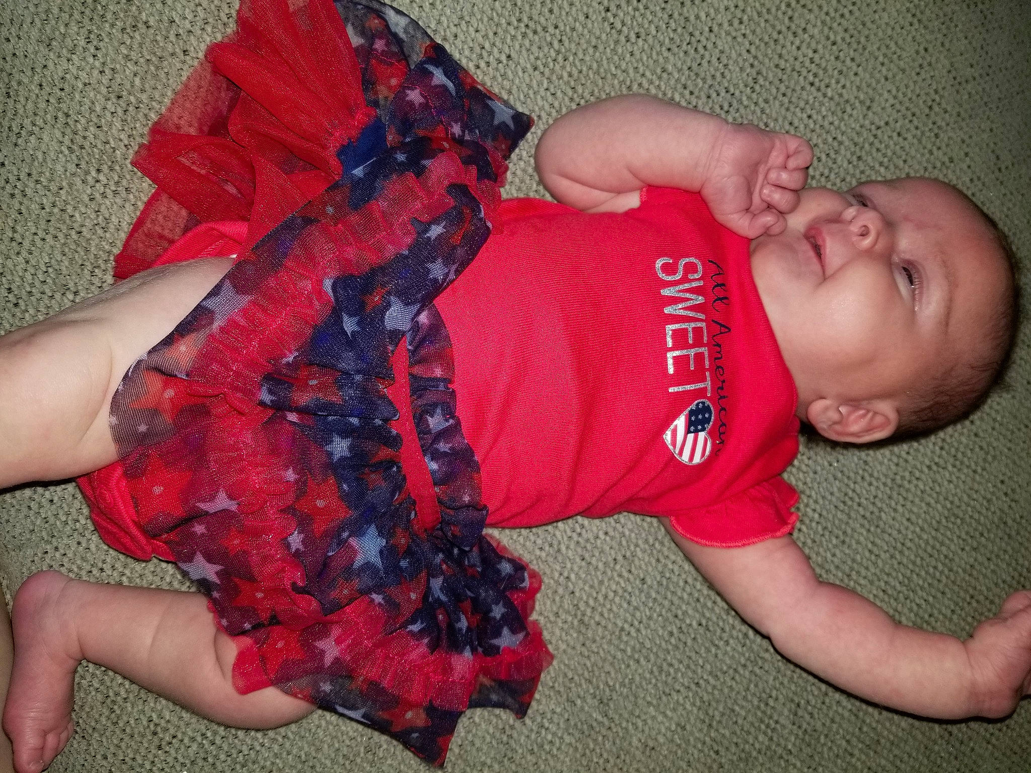 Ireland is registered to the contest to win money with this photo: arm, baby, baby_toddler_clothing, child, finger, hand, person, thumb, toddler