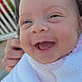 Aria participe au concours pour gagner de l'argent avec cette photo : apparel, baby, blanket, casual_clothing, child, closeup, expression, face, hand, happy, head, holding, human, infant, joy, outdoor, person, portrait, skin, smile