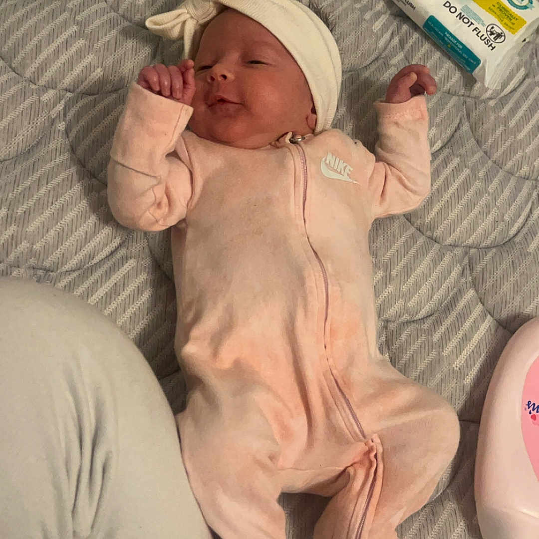 Nevaeh is registered to the contest to win money with this photo: architecture, baby, bed, bodypart, building, clothing, couch, cushion, face, finger, furniture, hand, hat, head, homedecor, newborn, person, photography, portrait, sleeping