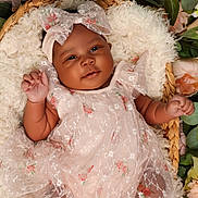 Serenity is registered to the contest to win money with this photo: baby, infant, basket, flower, floral, dress, bow, headband, smile, cute, soft, cozy, blanket, greenery, pink, white, portrait, child, newborn, happy