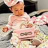 baby, child, pink, headband, flower, purse, pearl, bed, blanket, soft, curious, cute, clothing, sitting, indoors, infant, portrait, decorative, fabric, accessory