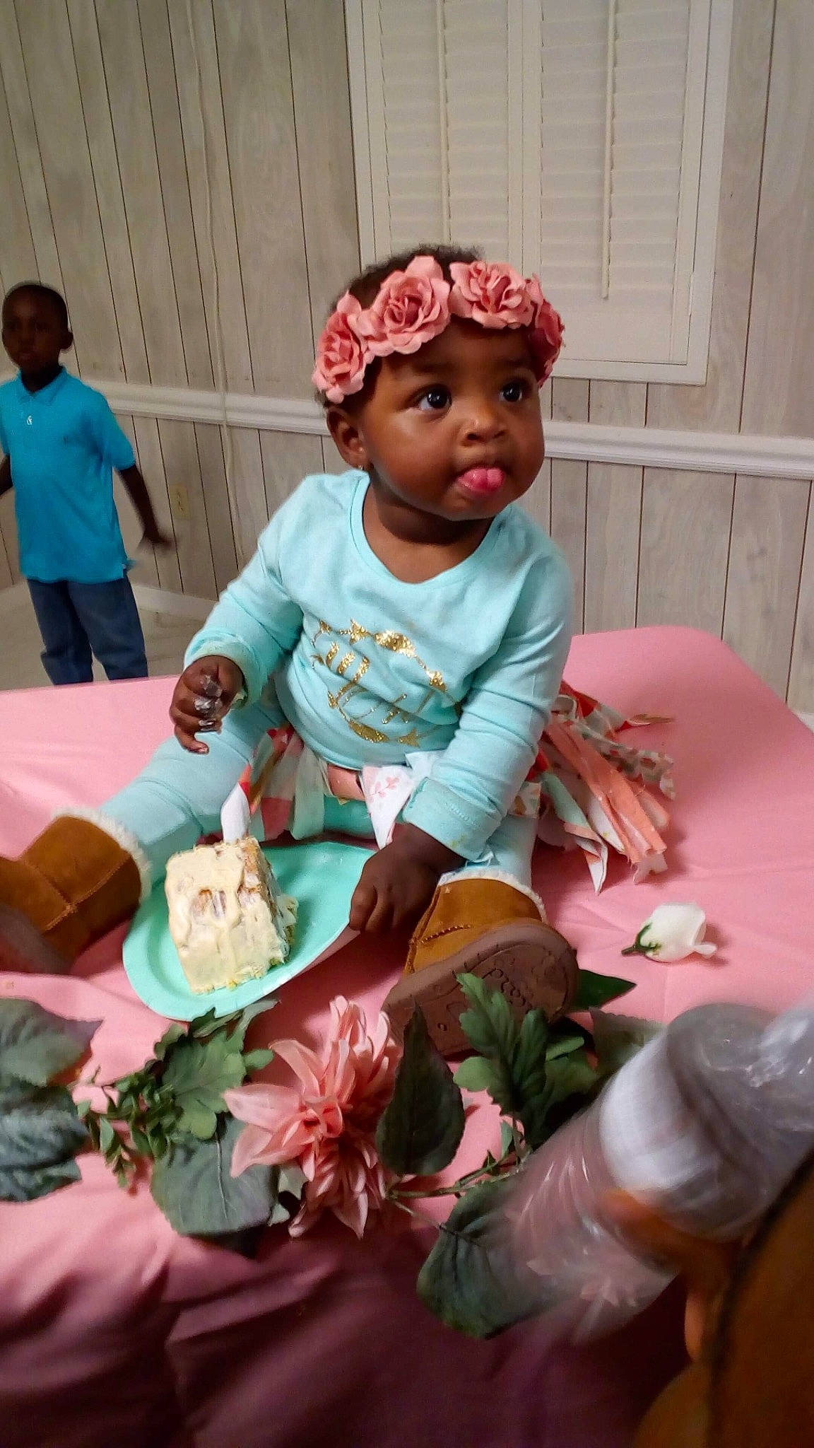 Casey is registered to the contest to win money with this photo: child, flower, girl, hair_accessory, headgear, headwear, infant, person, pink, play, sitting, textile, toddler