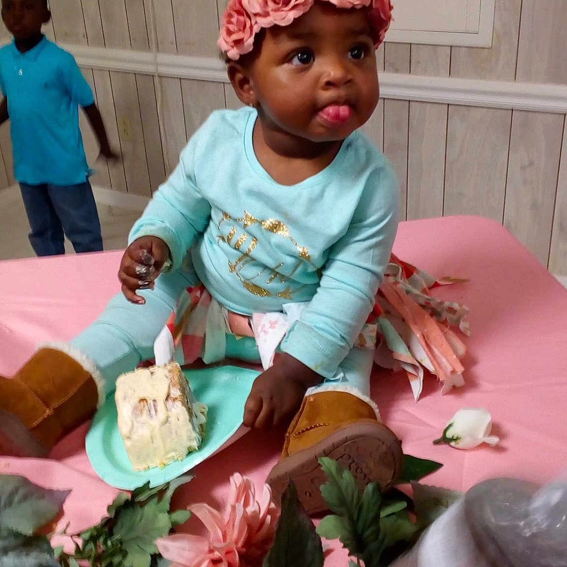 Casey is registered to the contest to win money with this photo: child, flower, girl, hair_accessory, headgear, headwear, infant, person, pink, play, sitting, textile, toddler
