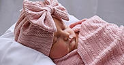 Brynlee is registered to the contest to win money with this photo: baby, sleeping, pink, blanket, hat, bow, cozy, newborn, infant, soft, texture, cute, resting, portrait, child, peaceful, indoors, headwear, closeup, toddler