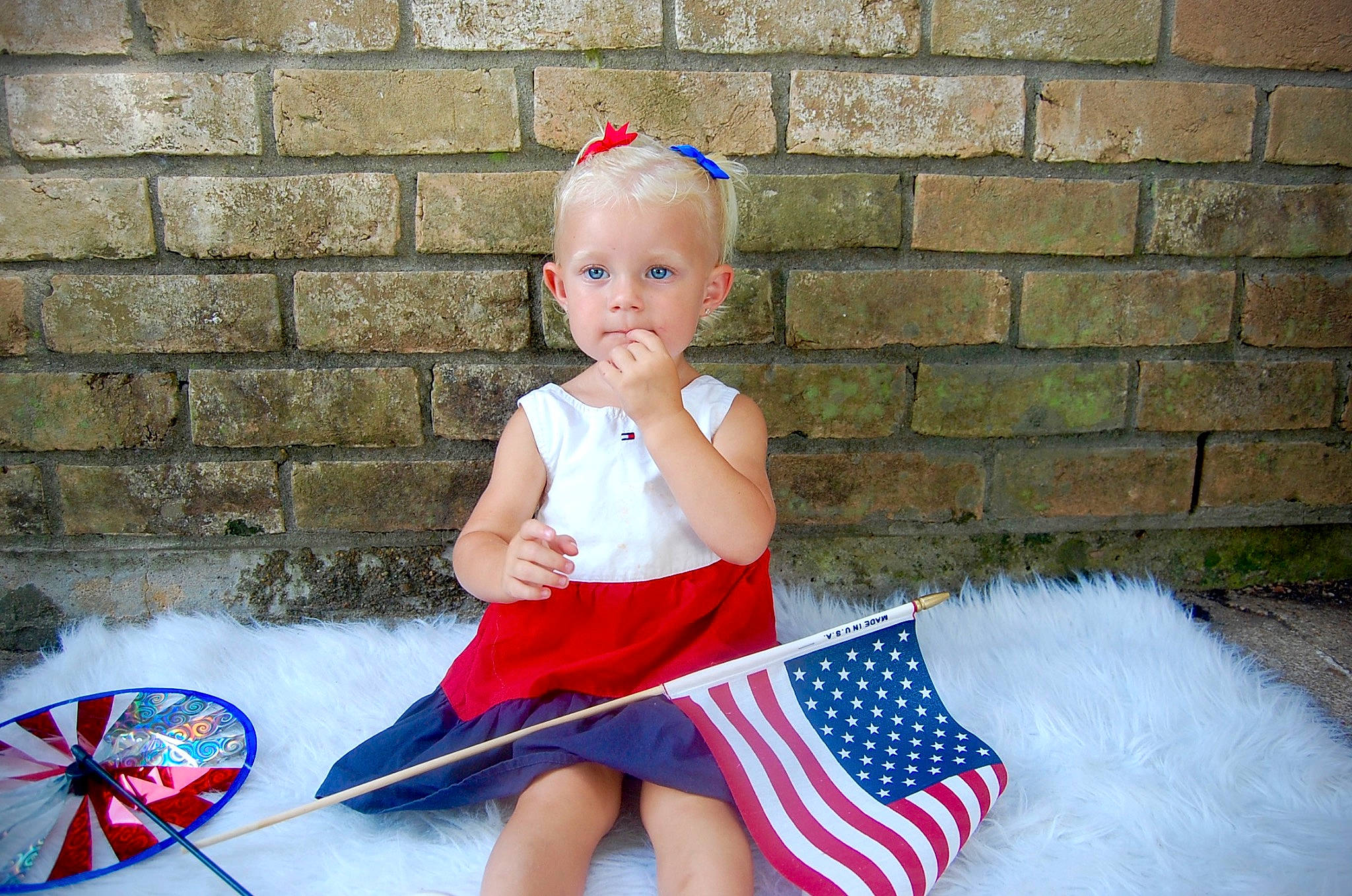 Addisyn is registered to the contest to win money with this photo: baby, baby_toddler_clothing, child, costume, costume_hat, electric_blue, event, fashion_accessory, fun, happy, hat, human_leg, leisure, magenta, pattern, person, sitting, sleeve, smile, toddler