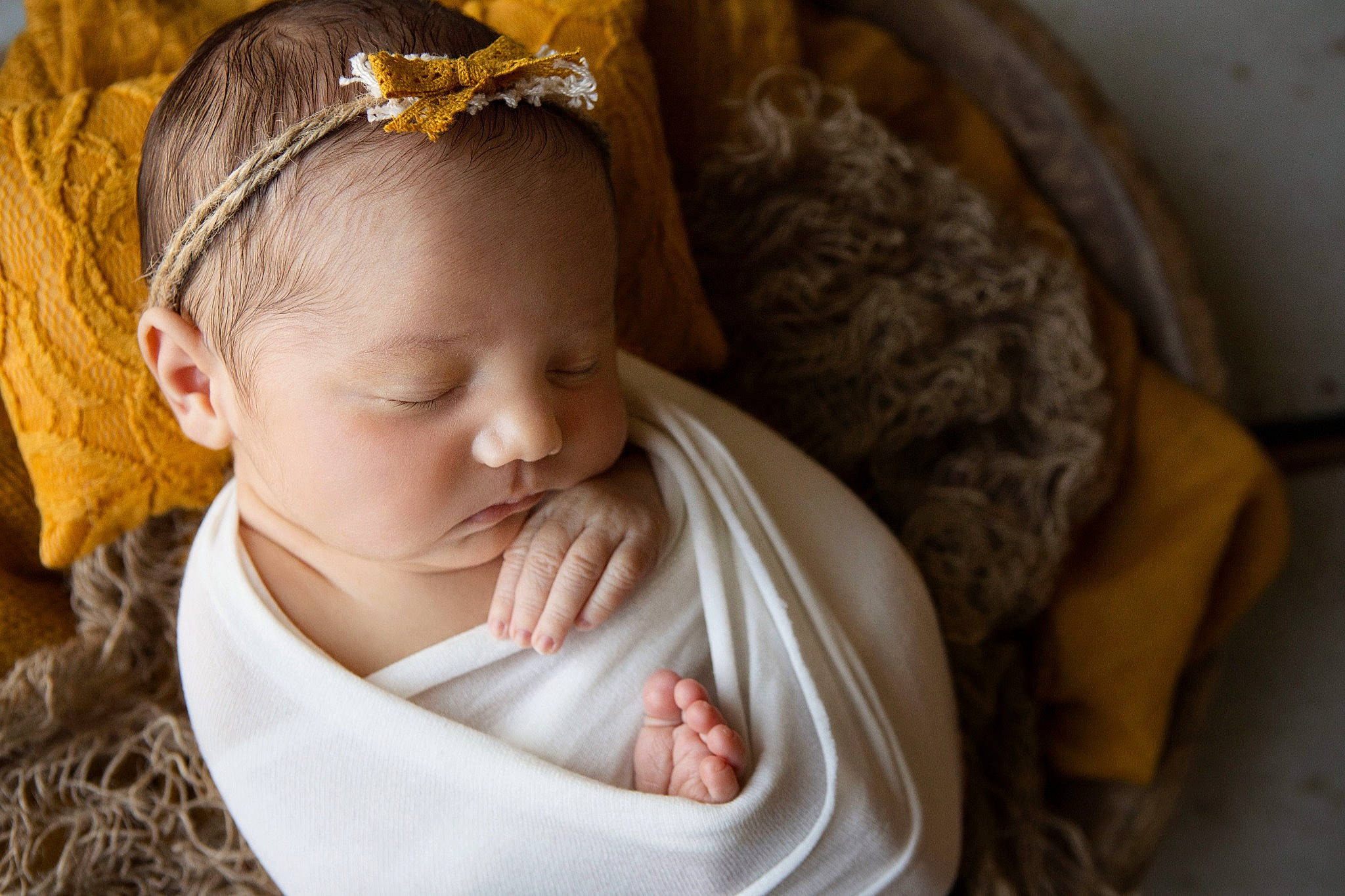 Penelope is registered to the contest to win money with this photo: baby, baby_toddler_clothing, cheek, child, chin, comfort, dress, ear, eye, goggles, grass, hand, happy, head, headband, human_body, iris, lip, person, skin