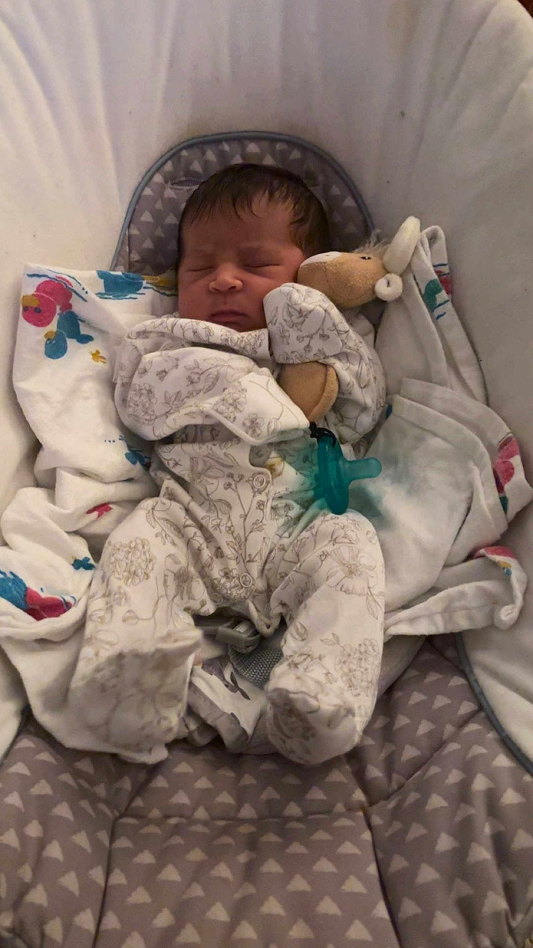 Nova joined the competition — help win amazing prizes! newborn, baby, sleeping, onesie, plush_toy, blanket, baby_seat, infant, cozy, cute, child, soft, resting, indoors, peaceful, clothing, comfort, toddler, portrait, cuddle