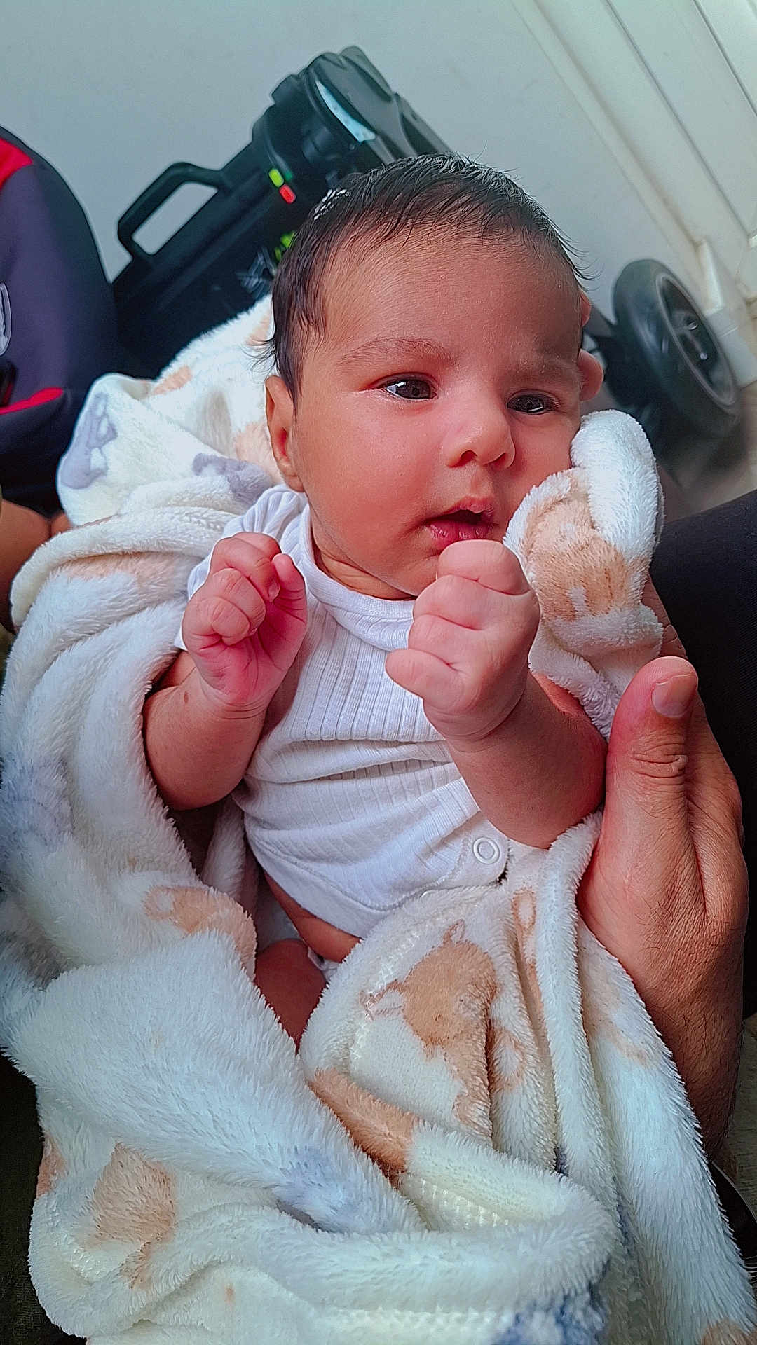 Nihaal is registered to the contest to win money with this photo: baby, blanket, infant, hands, face, person, newborn, clothing, soft, cute, curious, wrapped, human, skin, portrait, indoors, fingers, holding, warm, toddler