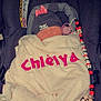 baby, car_seat, blanket, sleeping, hat, pacifier, toy, minnie_mouse, cozy, child, infant, cute, pink, white, beads, clothing, accessory, resting, safety, indoor