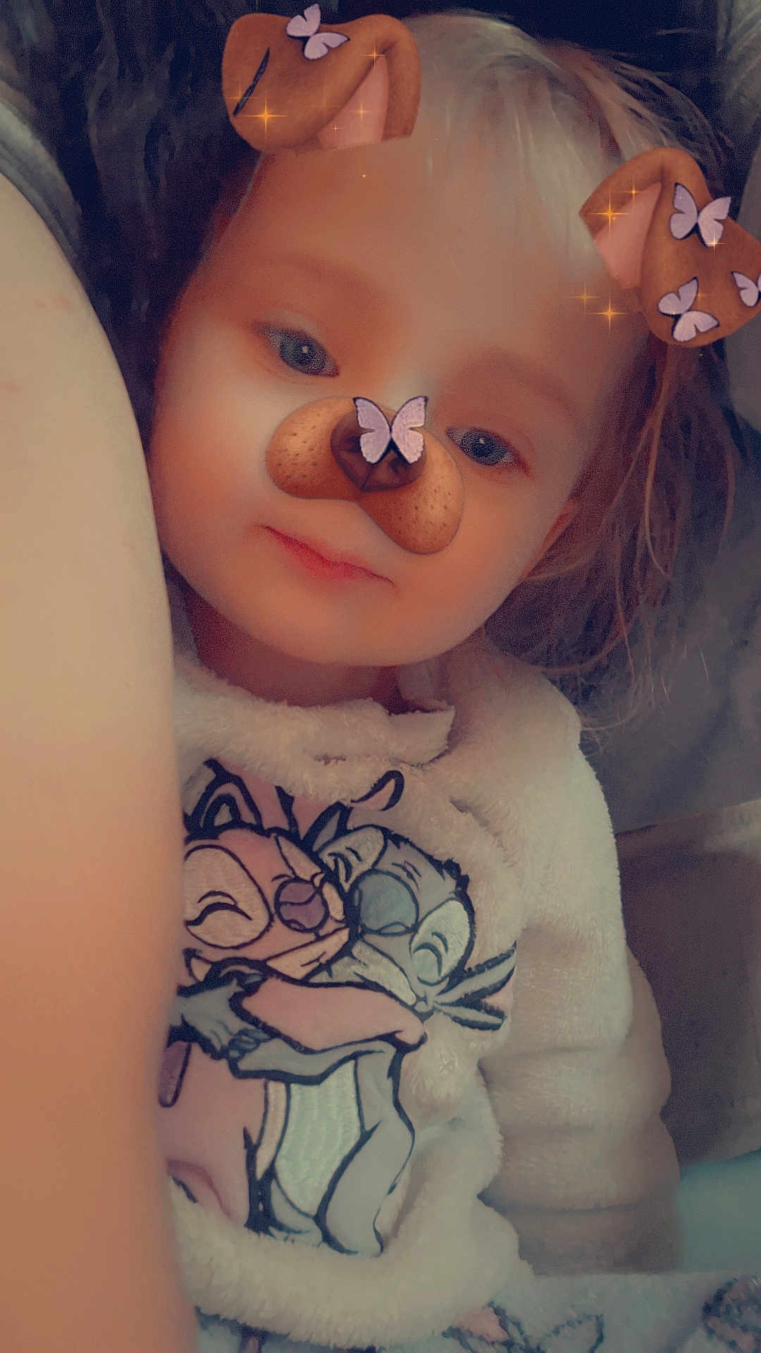 Chlélya participe au concours pour gagner de l'argent avec cette photo : child, face_filter, dog_ears, butterfly, sweater, cartoon_characters, hugging, cozy, fluffy, portrait, smile, indoor, cute, baby, young_child, closeup, soft_light, casual, fun, playful