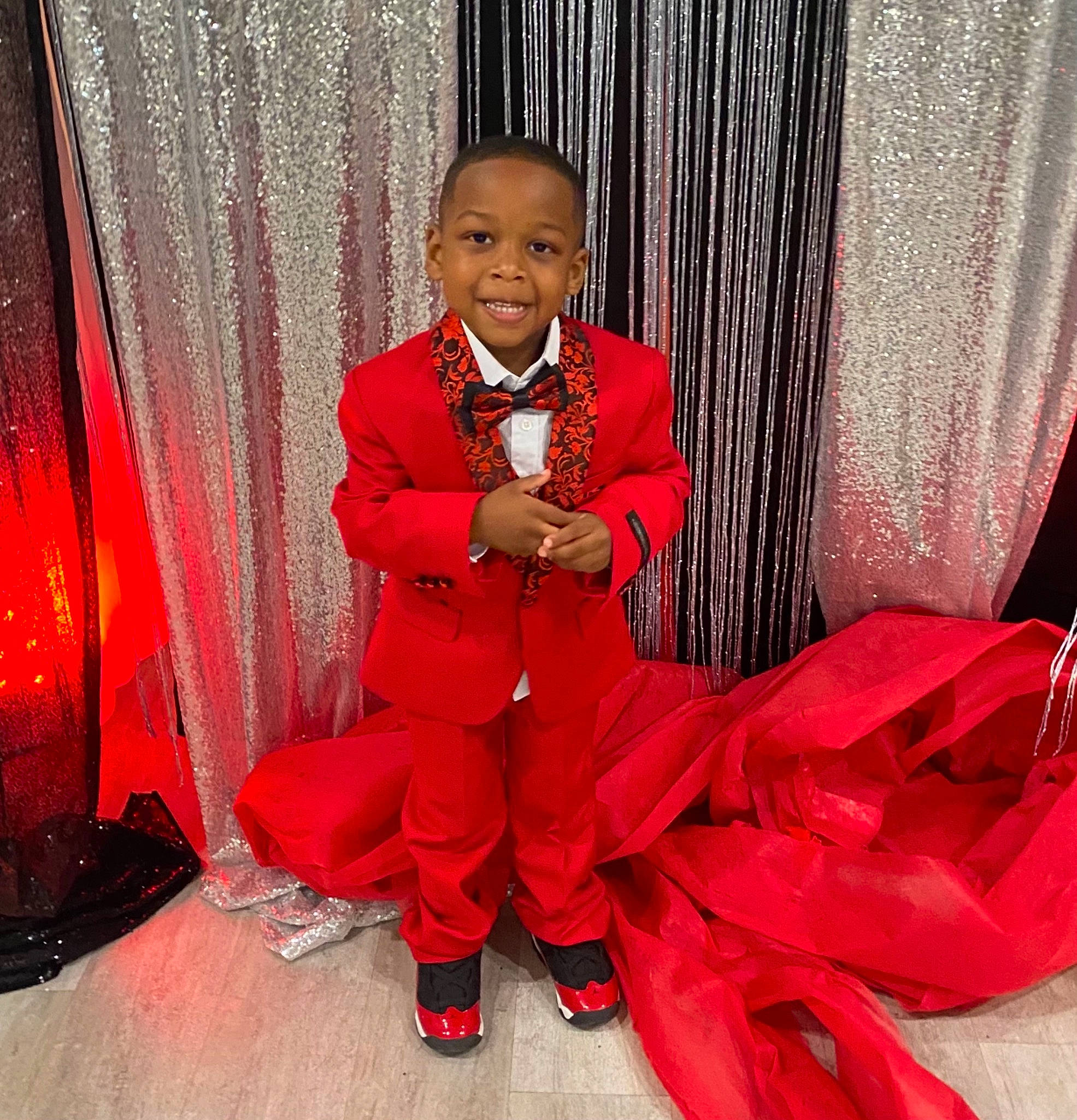 Naeem joined the competition — help win amazing prizes! carmine, curtain, event, fashion, fashion_design, flooring, formal_wear, fun, happy, joy, magenta, peach, person, pink, shoe, sitting, sleeve, smile, suit, textile