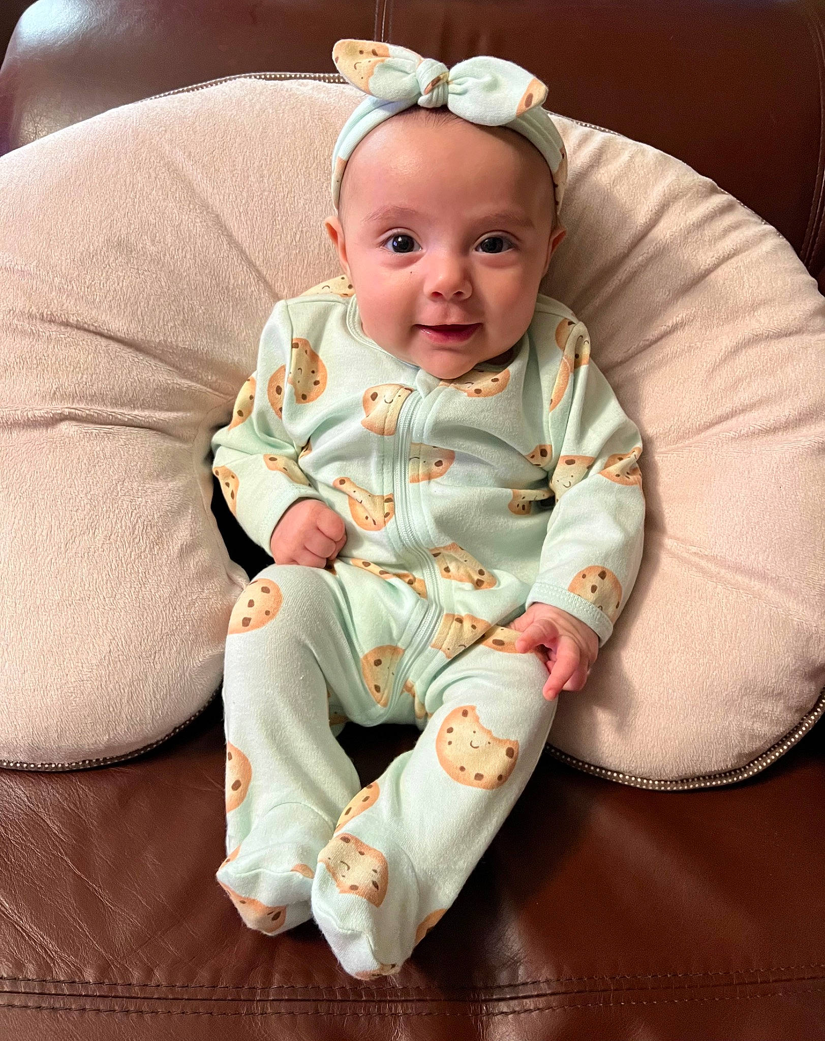 Abigail is registered to the contest to win money with this photo: baby, baby_products, baby_toddler_clothing, chair, cheek, child, collar, comfort, costume_hat, face, headband, headgear, headpiece, linens, person, sitting, sleeve, smile, t_shirt, toddler