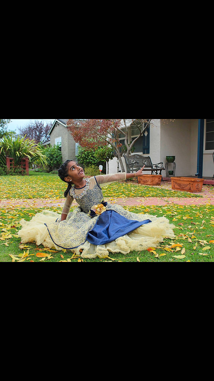 Sreshta is registered to the contest to win money with this photo: adaptation, grass, lawn, person, photography, plant, sitting, tree