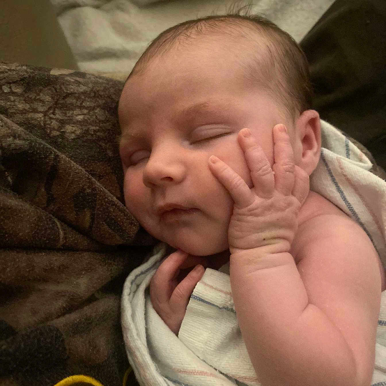 Kinlynn is registered to the contest to win money with this photo: architecture, baby, bed, blanket, bodypart, building, clothing, face, finger, furniture, glove, hand, head, newborn, person, photography, portrait, quilt, sleeping, towel