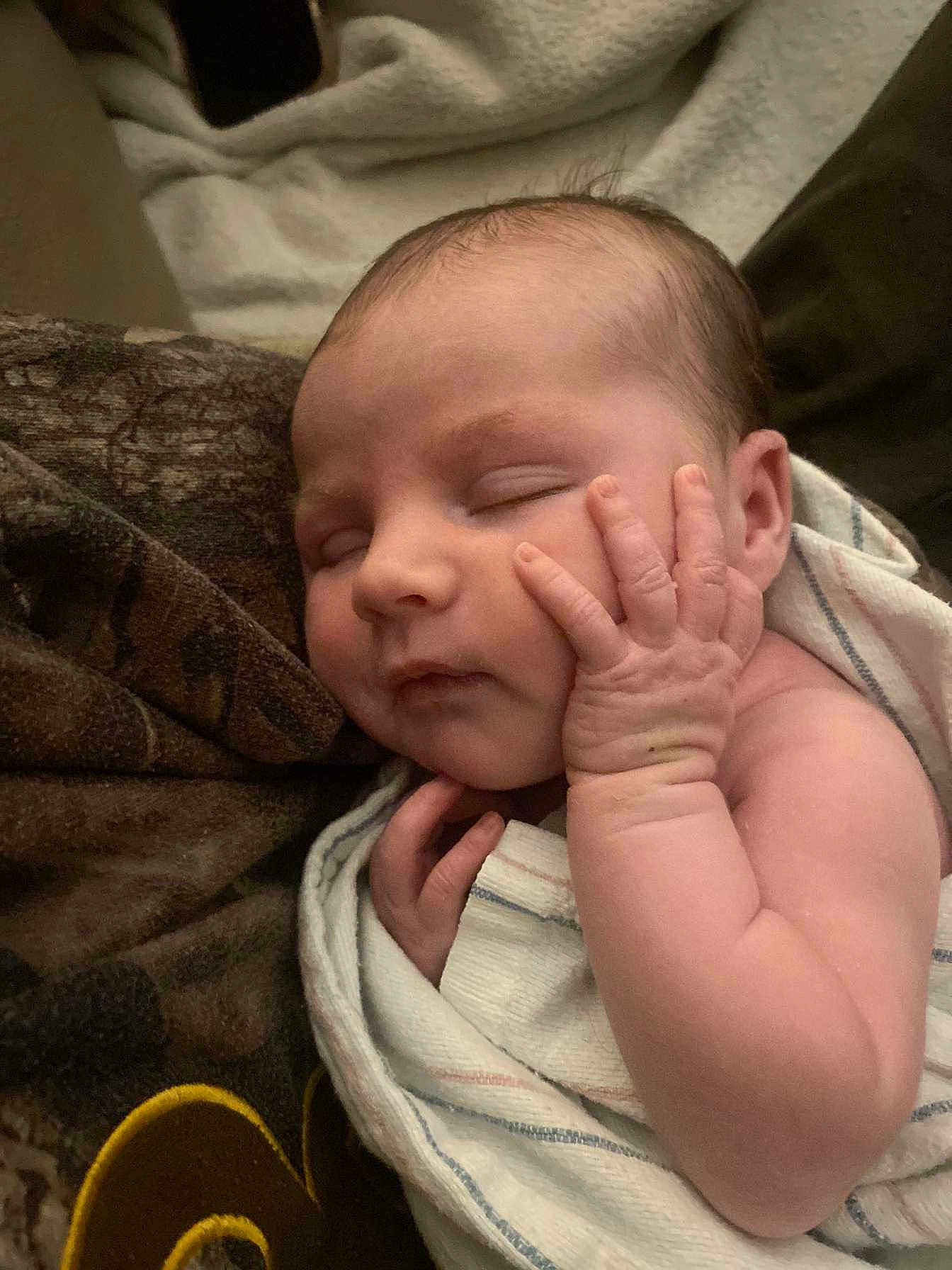 Kinlynn is registered to the contest to win money with this photo: architecture, baby, bed, blanket, bodypart, building, clothing, face, finger, furniture, glove, hand, head, newborn, person, photography, portrait, quilt, sleeping, towel