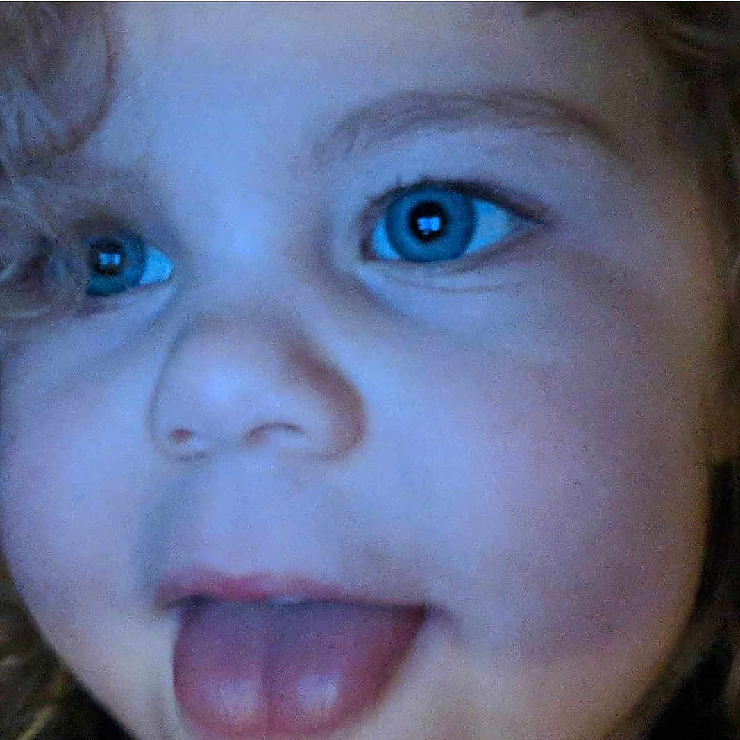 Olivia is registered to the contest to win money with this photo: cheek, child, chin, close_up, eye, eyebrow, eyelash, face, facial_expression, forehead, head, iris, lip, mouth, nose, organ, skin, smile, surprised, toddler