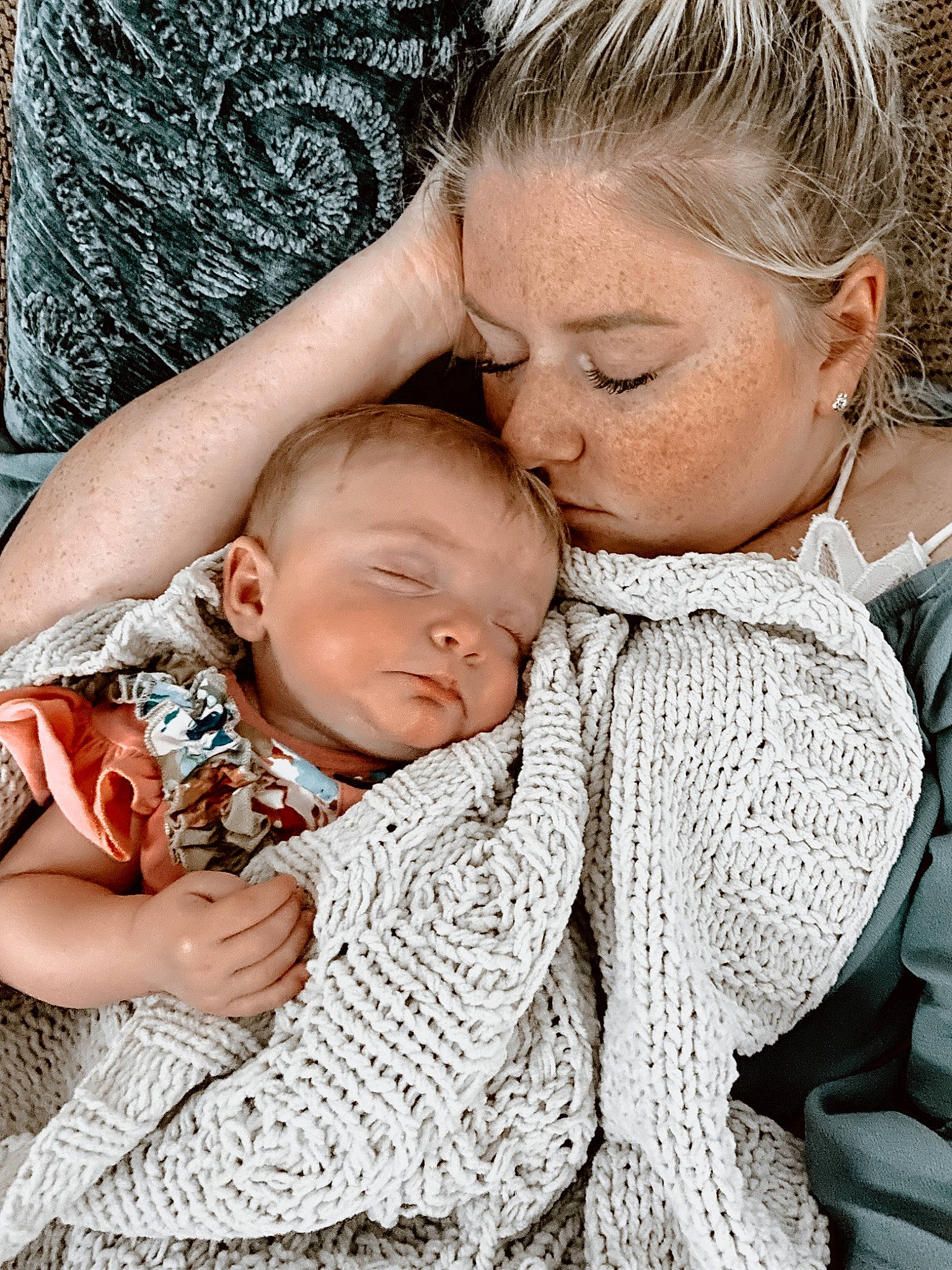 Oakleigh is registered to the contest to win money with this photo: baby, baby_toddler_clothing, cheek, child, comfort, face, gesture, grass, happy, head, interaction, kiss, linens, lip, pattern, people_in_nature, person, plant, sitting, skin
