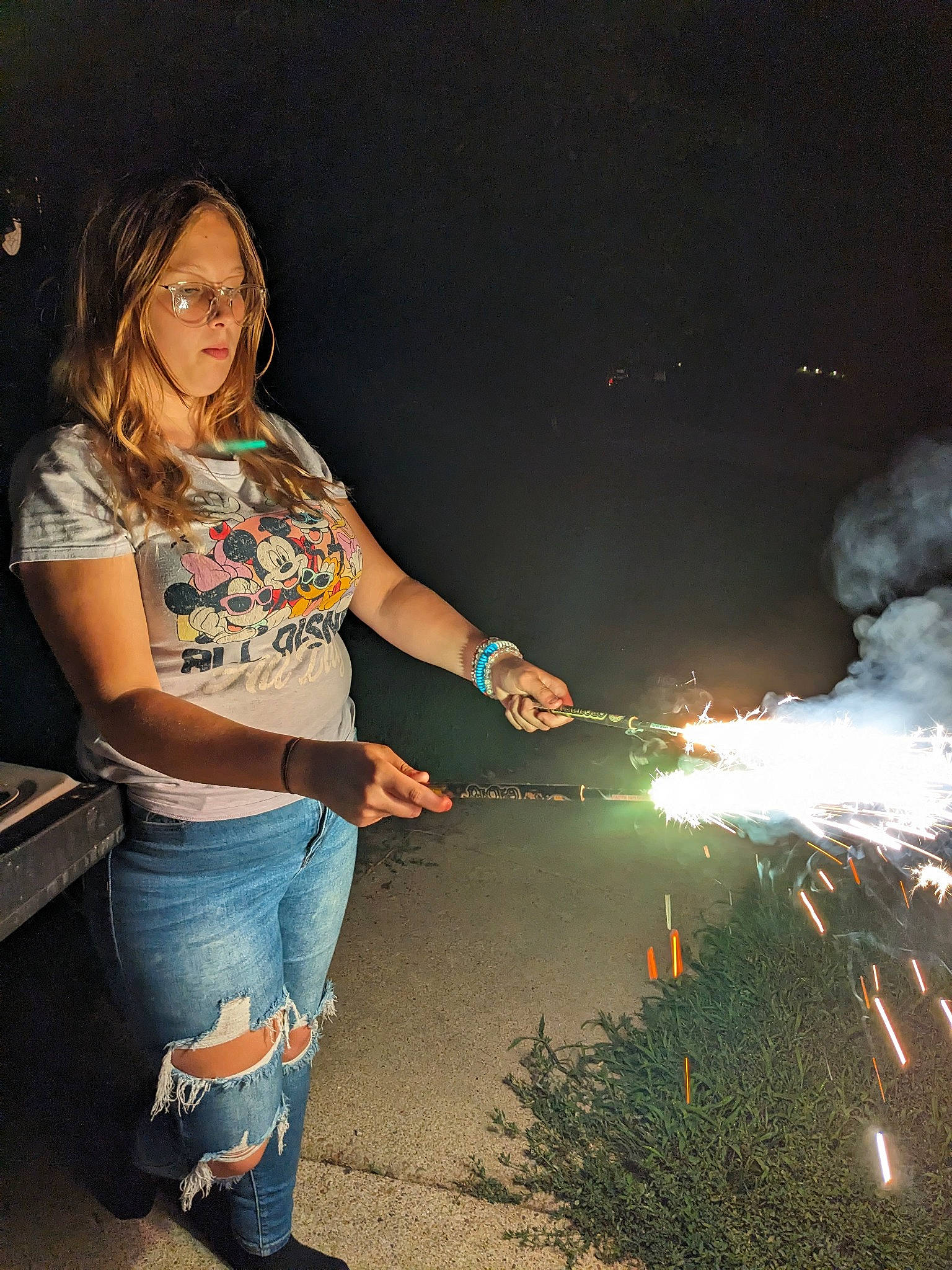 Aienna is registered to the contest to win money with this photo: denim, electric_blue, event, fire, fireworks, flash_photography, fun, grass, happy, heat, holiday, human_leg, jeans, landscape, leisure, midnight, people_in_nature, person, recreation, thigh