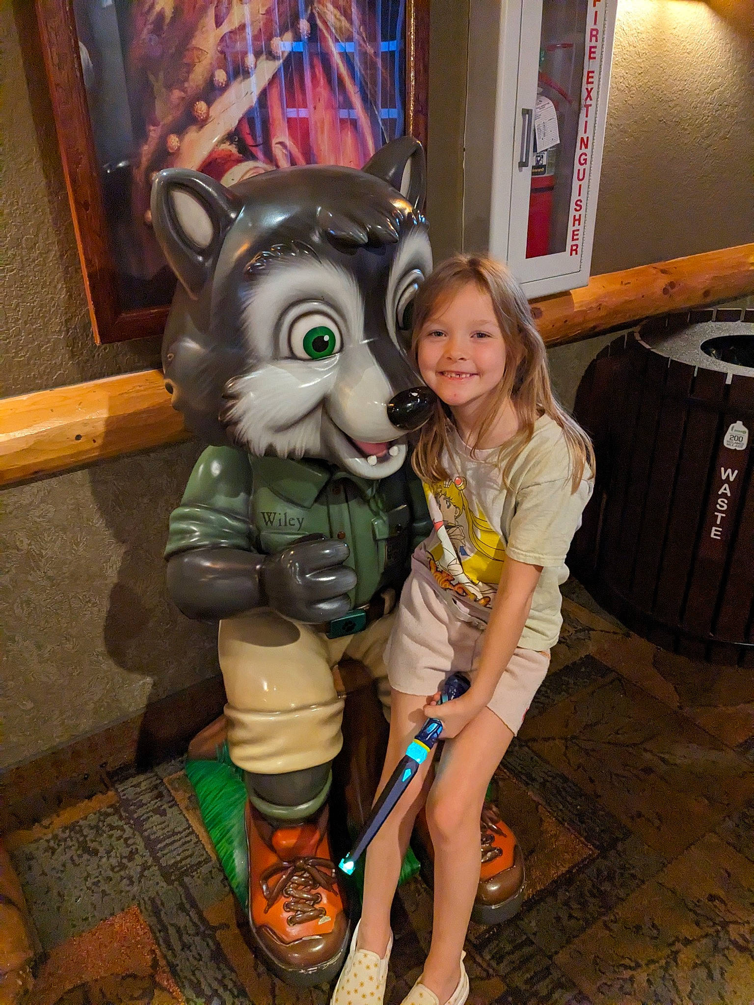 Temperance is registered to the contest to win money with this photo: bag, boot, fawn, flooring, foot, fun, fur, happy, human_leg, joy, knee, leg, leisure, luggage_and_bags, person, picture_frame, room, sandal, shorts, smile