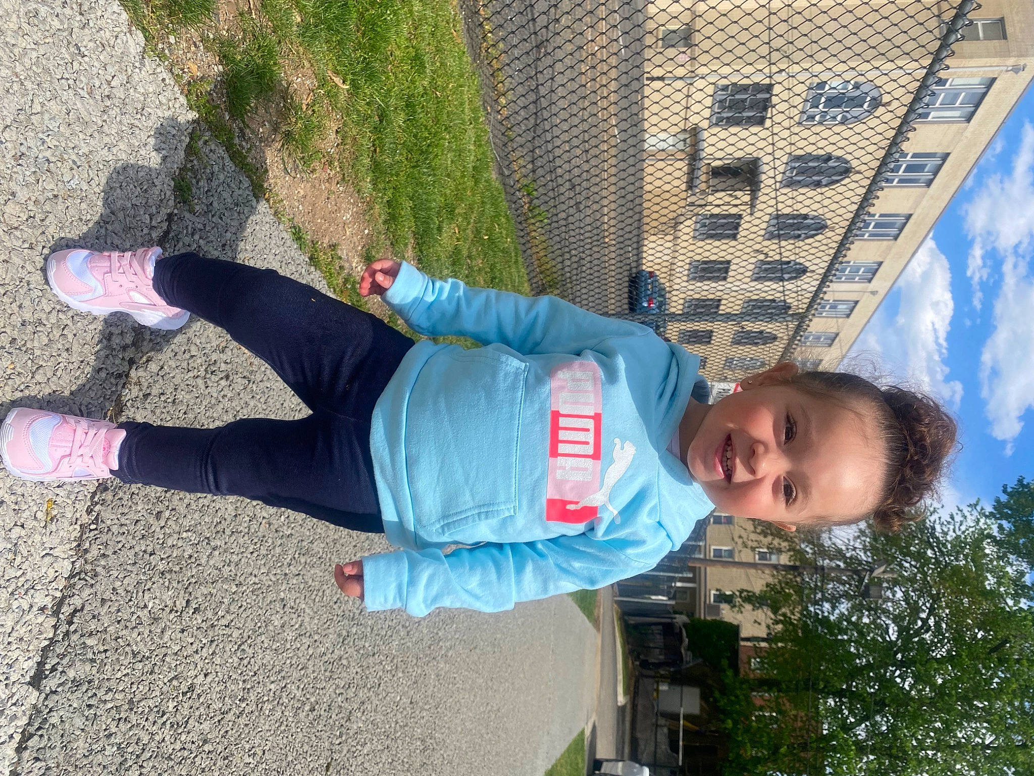 Ava Mckenzie is registered to the contest to win money with this photo: asphalt, cloud, electric_blue, fun, grass, happy, human_leg, joy, leisure, mesh, outdoor_shoe, person, plant, public_space, road_surface, shadow, sky, smile, t_shirt, toddler