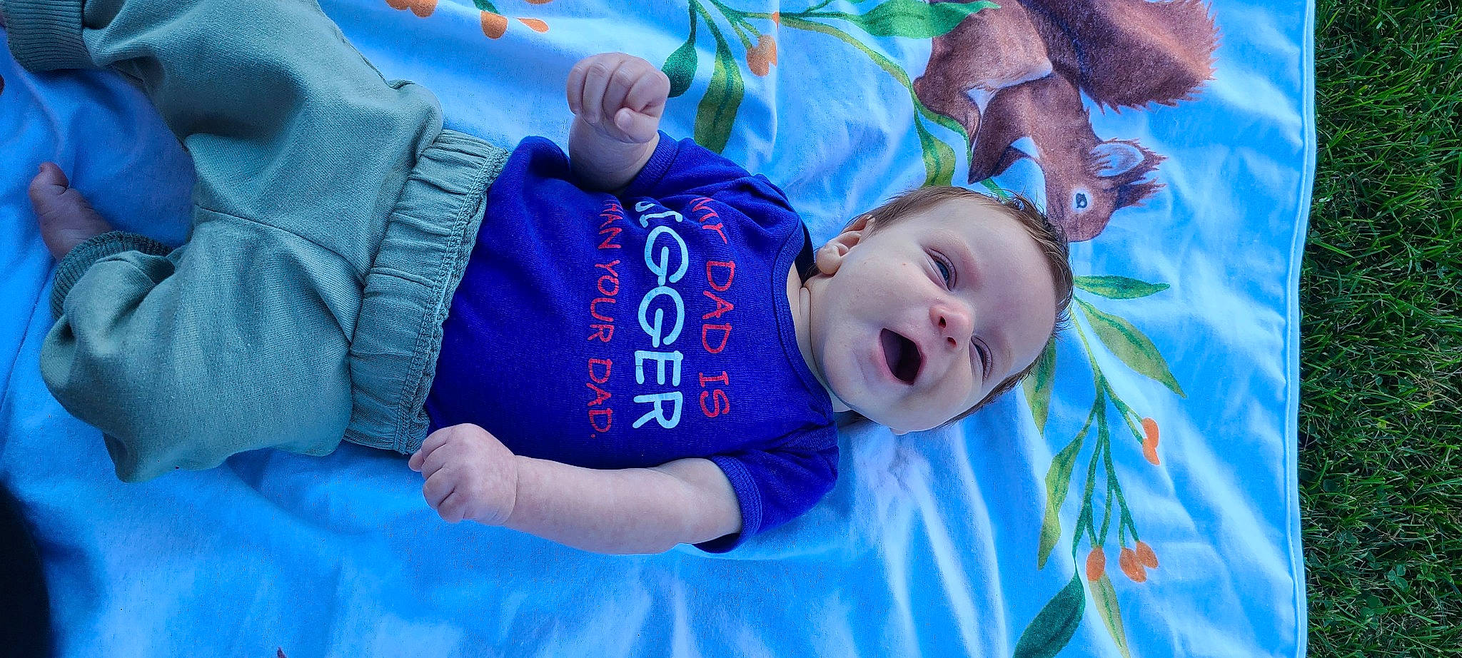 Brigham joined the competition — help win amazing prizes! azure, baby, baby_toddler_clothing, blue, cloud, comfort, eye, fun, grass, happy, head, leisure, mammal, mouth, person, purple, sky, smile, textile, toddler