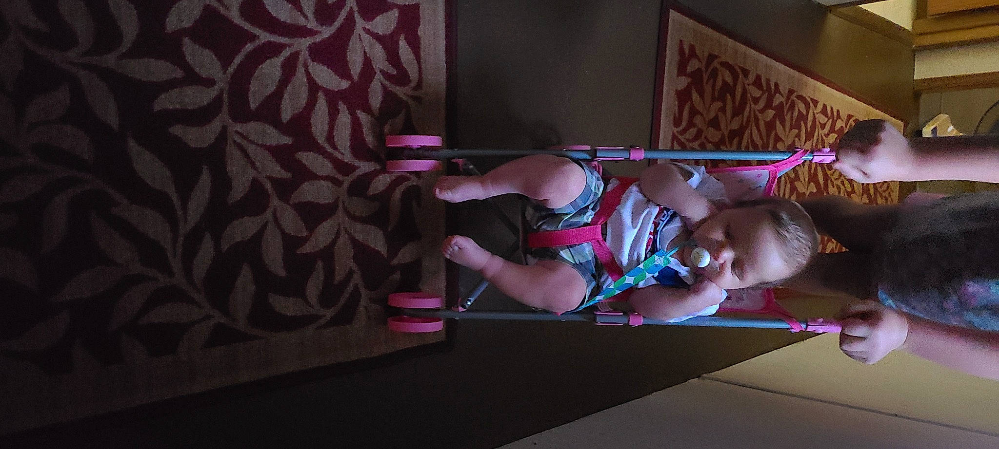 Brigham is registered to the contest to win money with this photo: child, darkness, elbow, entertainment, event, flash_photography, flooring, fun, human_leg, magenta, performance, performance_art, performing_arts, person, pink, purple, room, sitting, thigh, toddler