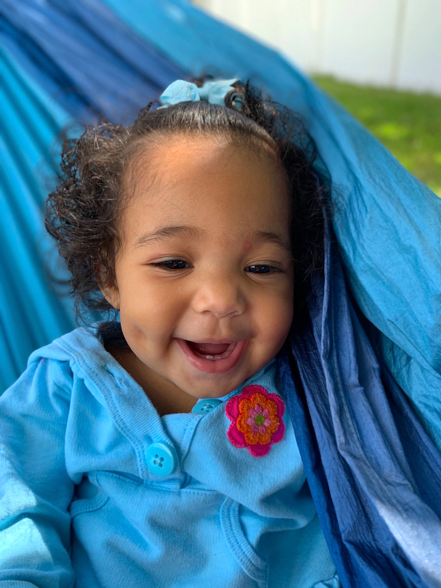 Amiah joined the competition — help win amazing prizes! baby, baby_toddler_clothing, cheek, child, facial_expression, happy, hood, iris, laugh, mouth, organ, person, shawl, skin, tarpaulin, textile, toddler, tongue, wrap