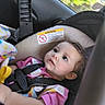 baby, child, car_seat, seatbelt, interior, car, window, face, curious, clothing, blanket, young_child, infant, safety, portrait, seat, looking, daylight, expression, young
