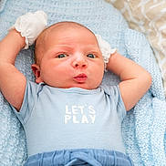 Hugo joined the competition — help win amazing prizes! baby, infant, blue_onesie, mittens, blanket, soft_texture, cute_expression, lying_down, puckered_lips, closeup, newborn, child, face, skin, head, person, indoor, playful, comfortable, cozy