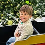 Michael is registered to the contest to win money with this photo: celebration, child, christmas_tree, cute, decoration, festive, happy, holiday, holiday_spirit, indoor, jeans, lights, ornaments, portrait, ride, seasonal, seat, smiling, sweater, young