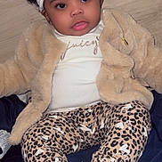 Alasia joined the competition — help win amazing prizes! baby, child, headband, bow, jacket, leopard_print, pants, socks, white_socks, cute, infant, fashion, portrait, smiling, indoor, floor, blanket, clothing, face, person